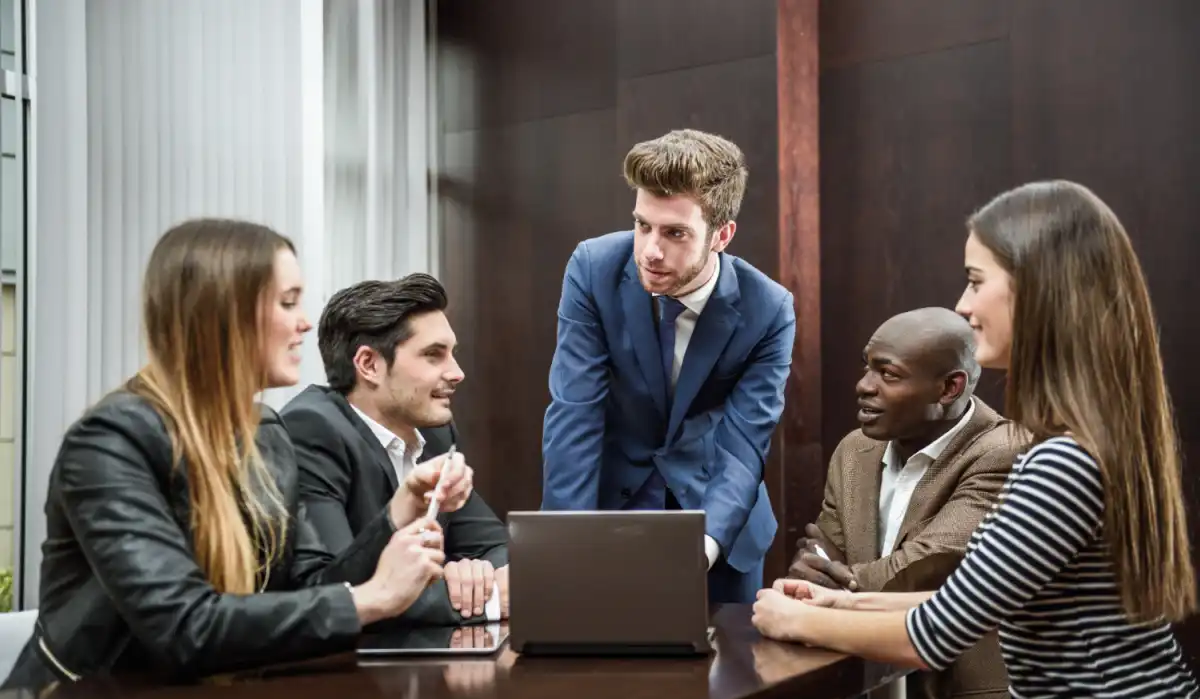 Team meeting to decide: build AI in-house or hire a specialist